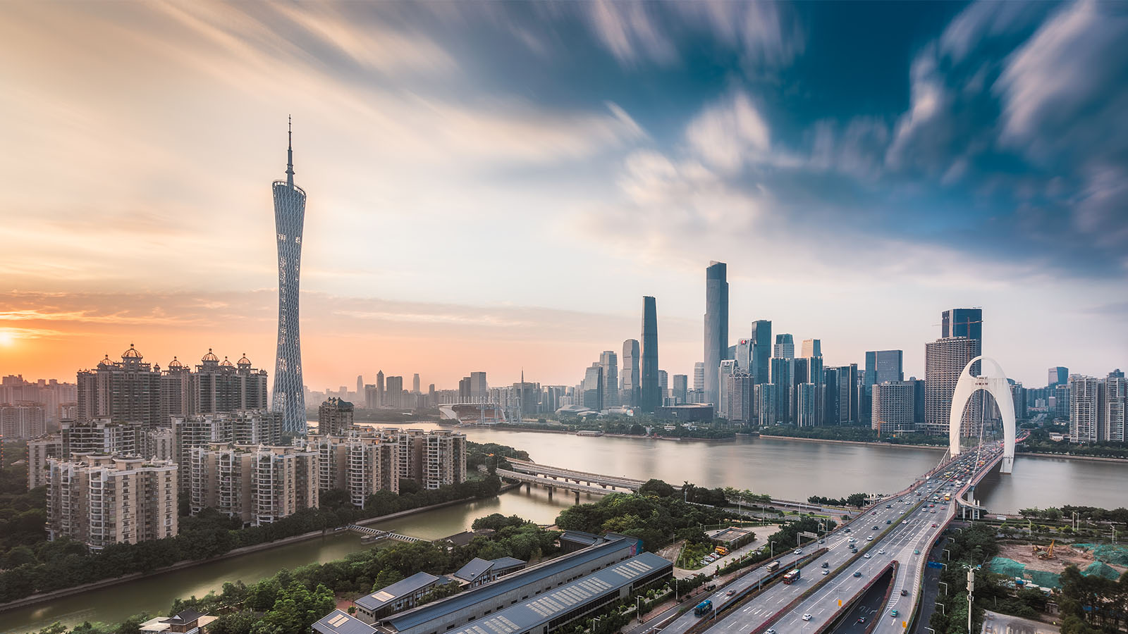 The TV tower and Liede Bridge over the Pearl River at sunset in Guangzhou, China