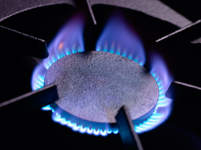 Blue flames on a gas cooker ring