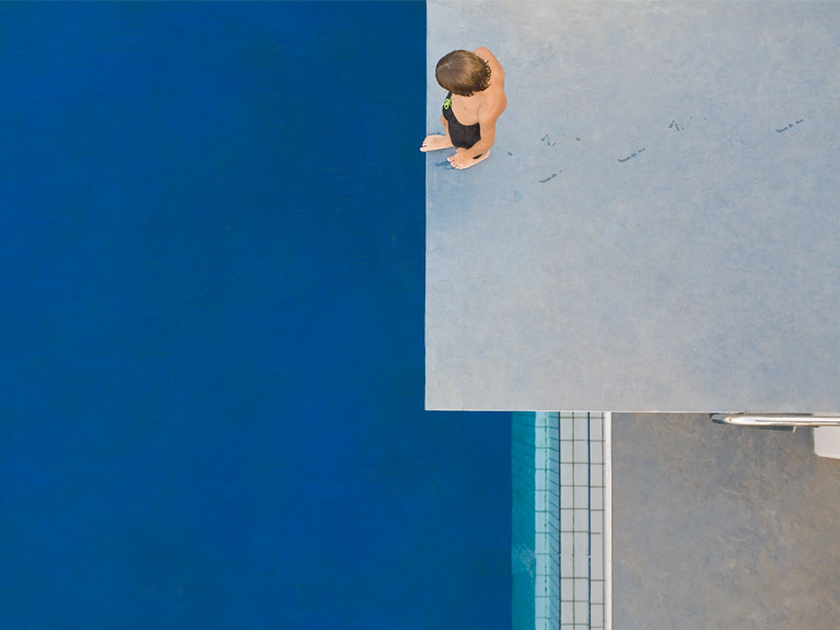 Preparing to jump from a high dive board