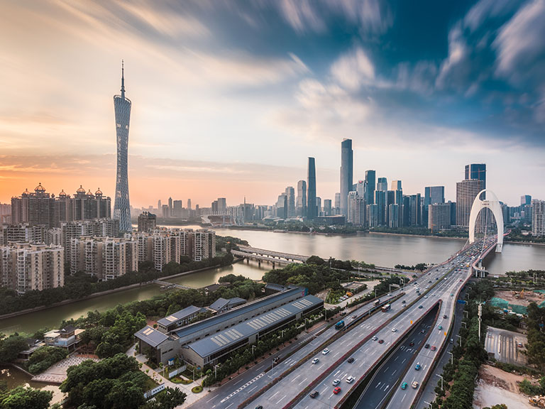 The TV tower and Liede Bridge over the Pearl River at sunset in Guangzhou, China